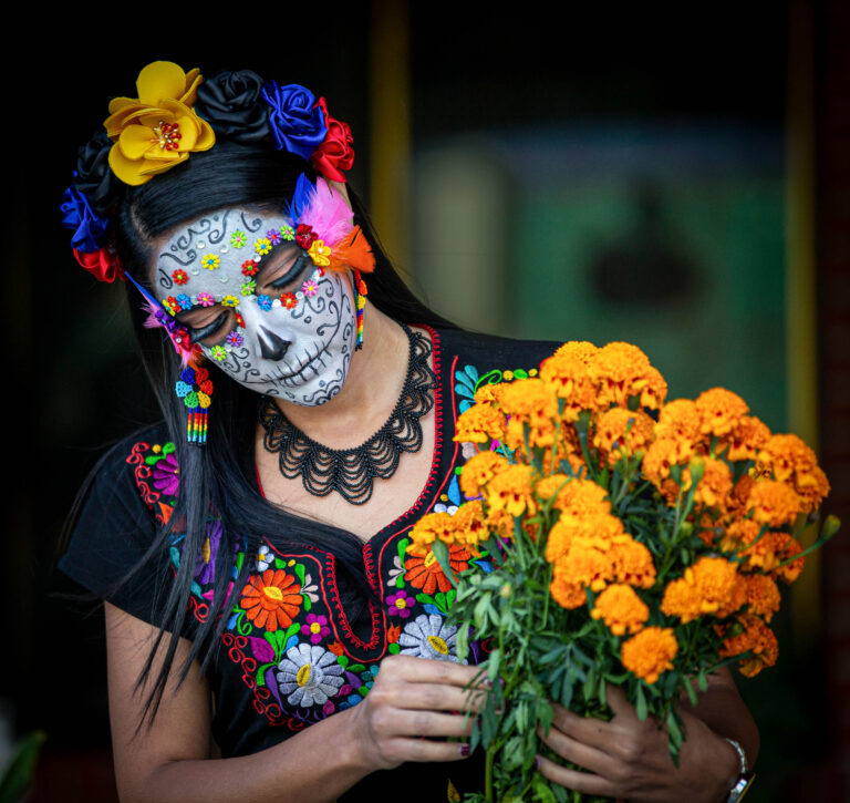 Woman's face with ceremonial make-up also known as Sugar skull, used in traditional Mexican Dia de los Muertos celebration